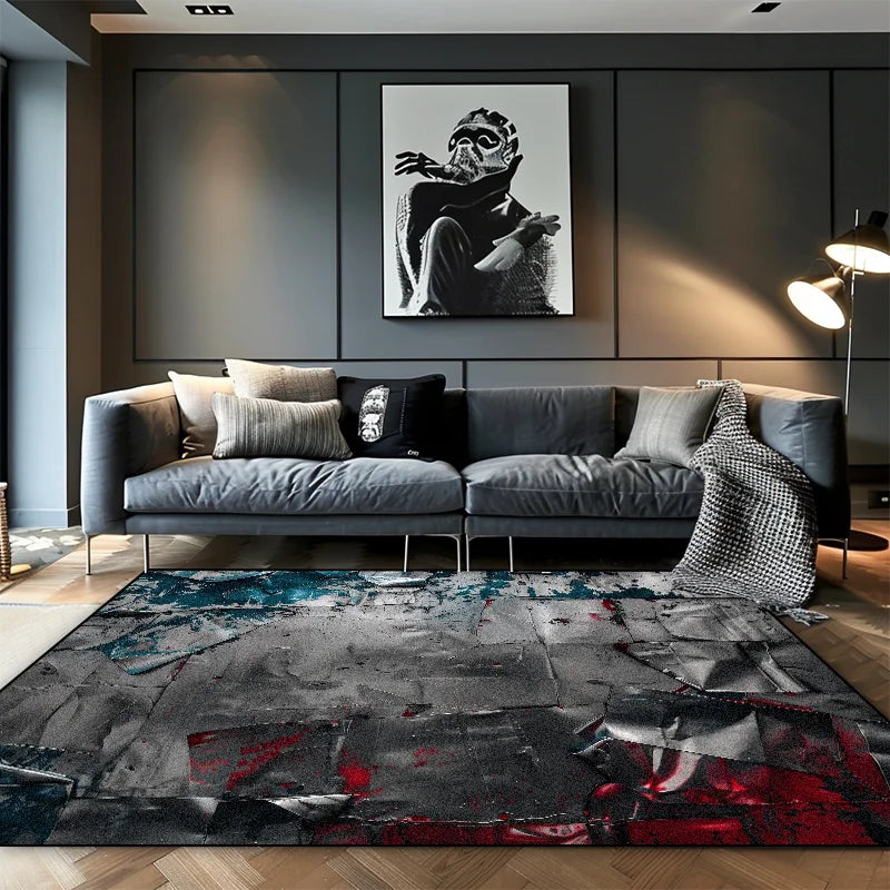 Grey cracked stone abstract area rug with teal and red paint splatter in a moody modern living room with grey sofa