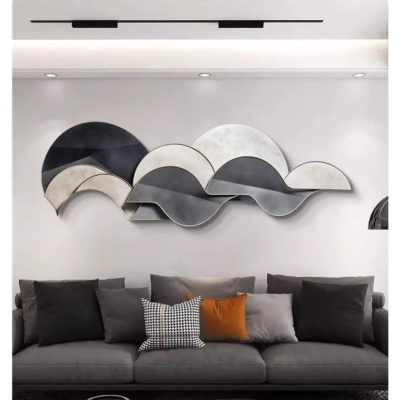 Abstract layered plexiglass wall light in neutral tones styled above a modern grey sofa