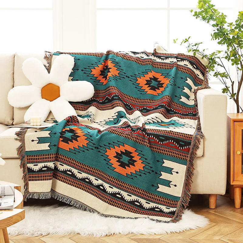 Abstract terracotta and slate blue woven chair throw with tribal geometric elements.