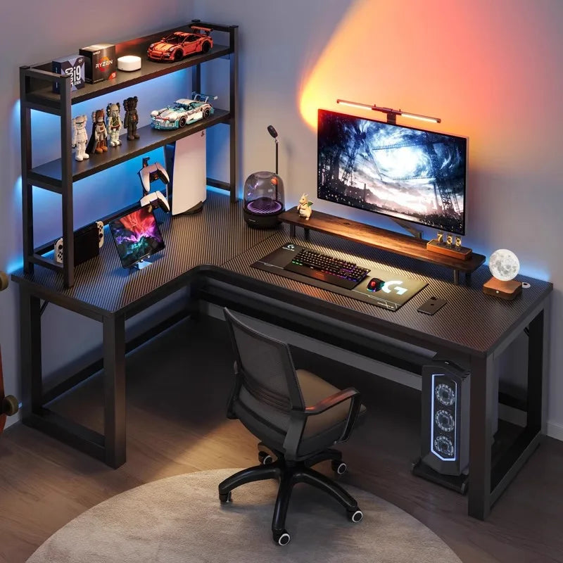Modern gaming desk setup with computer equipment and decorative items.