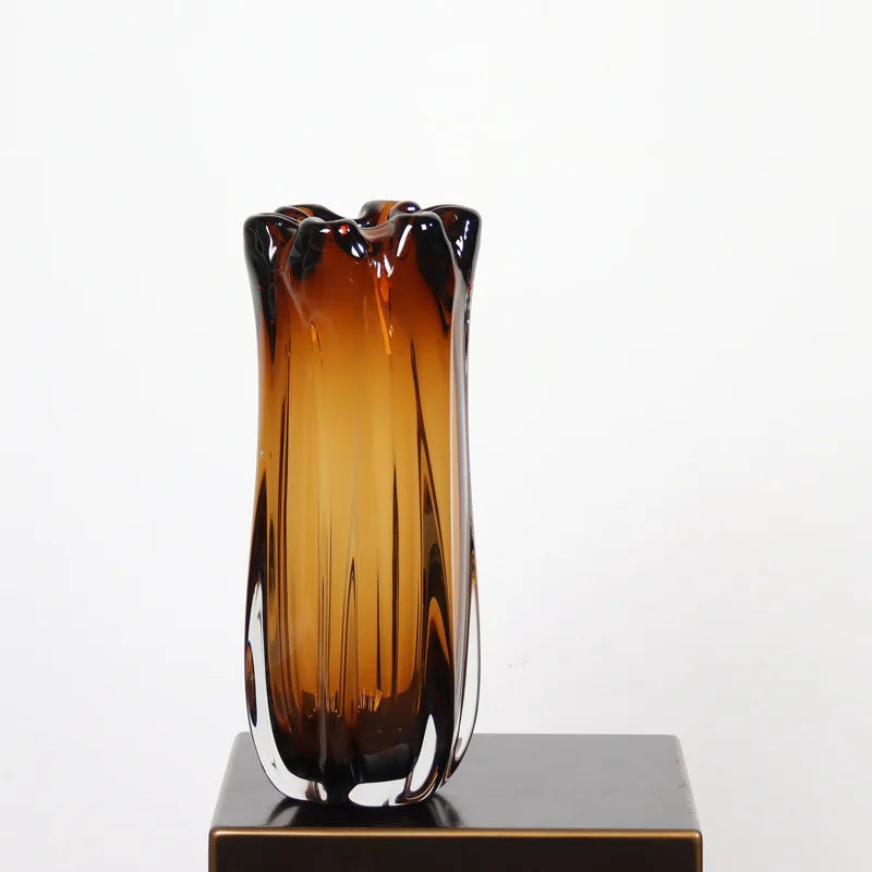 A large 35cm tall sculptural crystal glass vase in a rich cognac amber gradient.