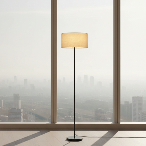 Full view of the minimalist Black Floor Lamp with a lit beige fabric shade.