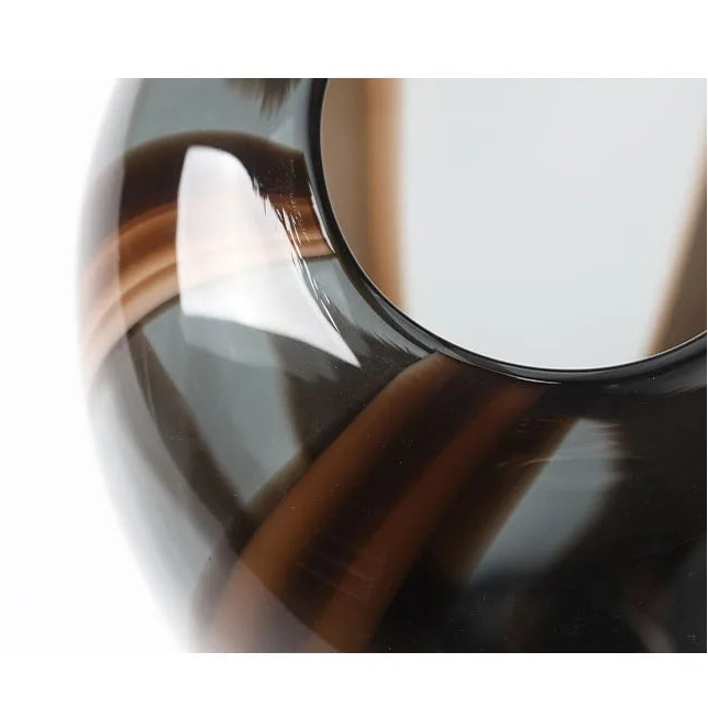 Close-up of high-gloss artistic glass swirl detail