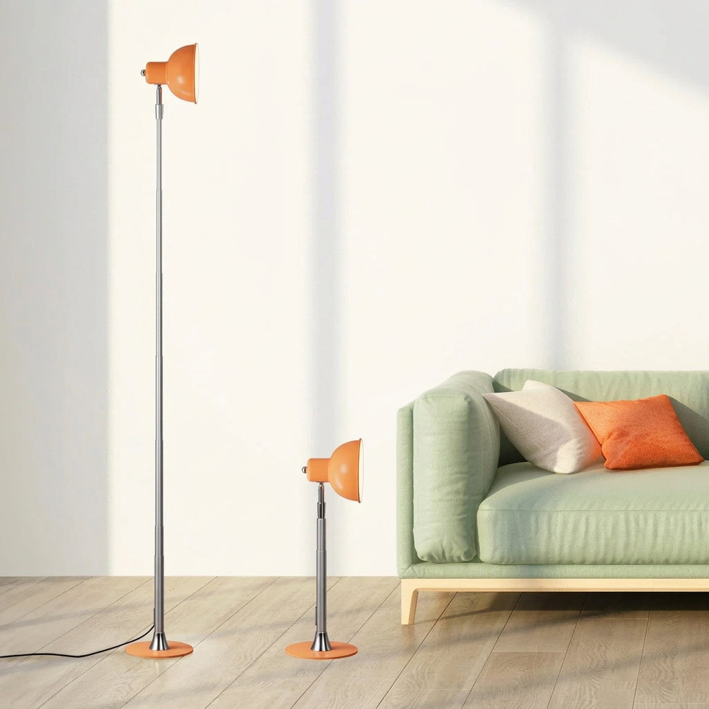 Orange adjustable floor lamp shown at full 145 cm height and lowest 45 cm height, beside a green sofa