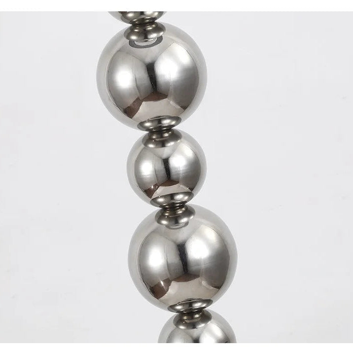 Close-up of polished stainless steel sphere lamp body detail