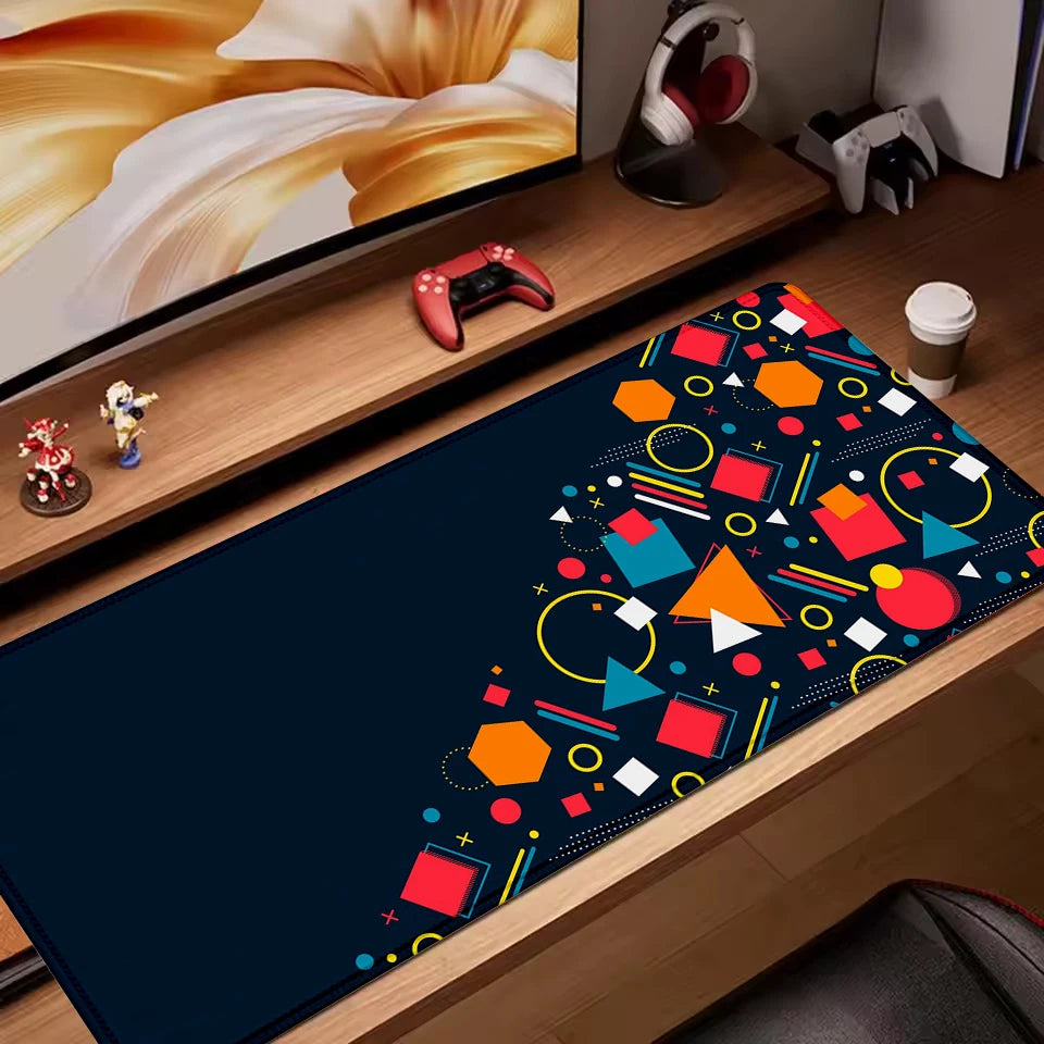 Retro geometric extended desk mat with colourful shapes on a dark navy background