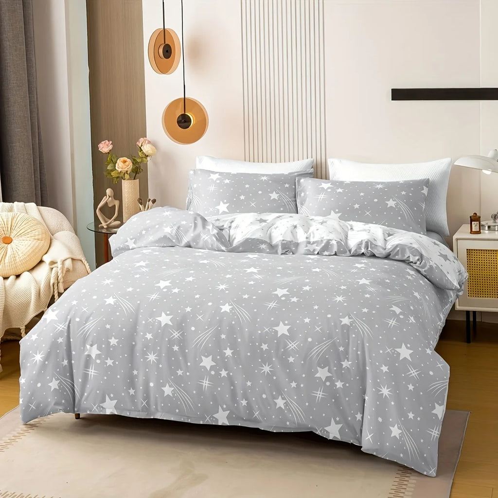 A slate grey star-patterned bedding set on a bed in a bedroom.