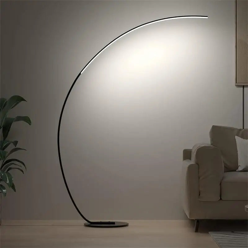 Modern floor lamp casting light in a living room setting