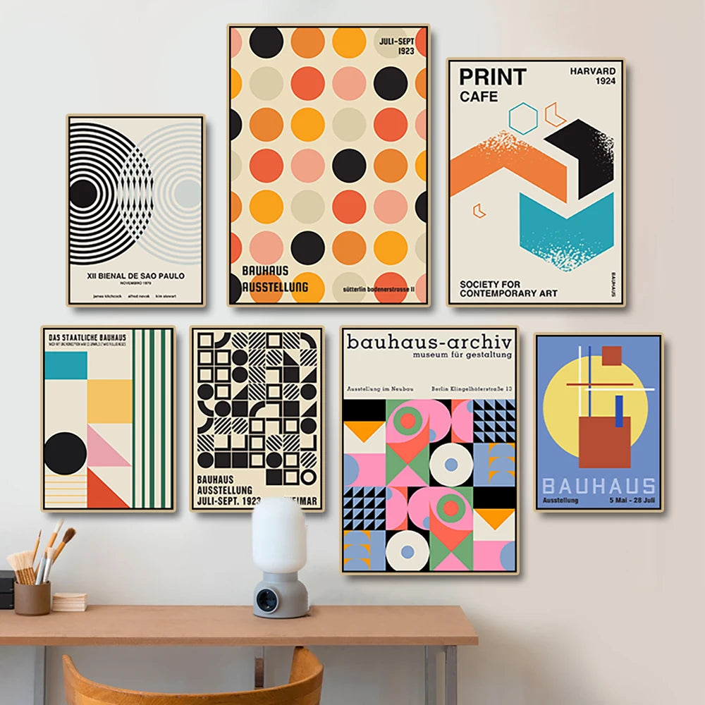 Collection of geometric posters on a wall above a desk