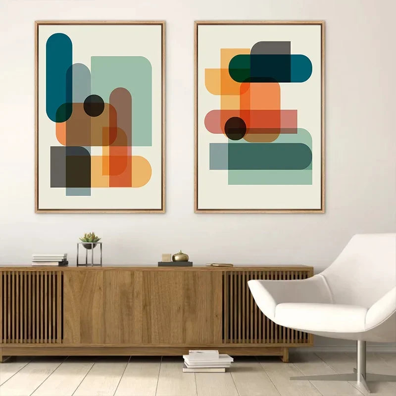 Modern living room with abstract art on the wall and a white chair.