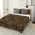 Soft tiger pattern fleece blanket on a bed.