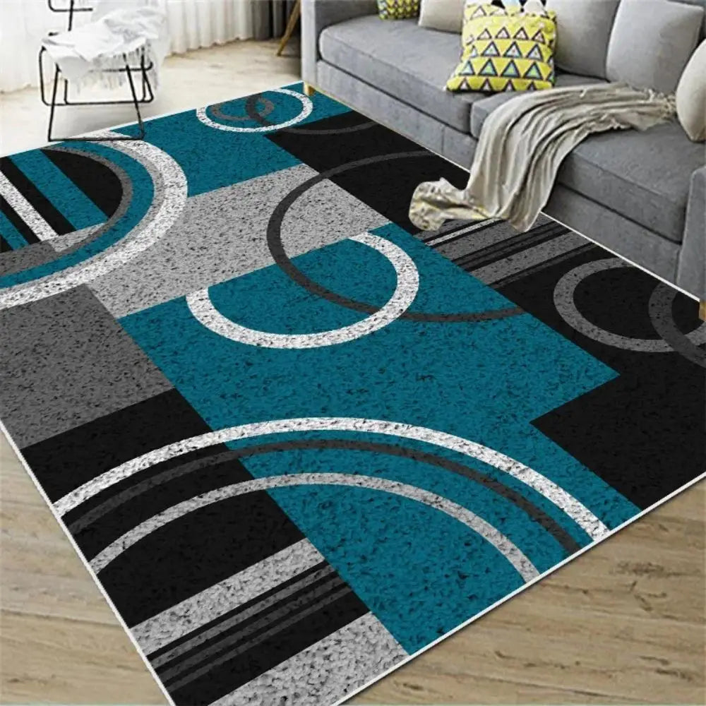 Blue teal, grey, black, and white Nordic geometric rug with abstract arc pattern.