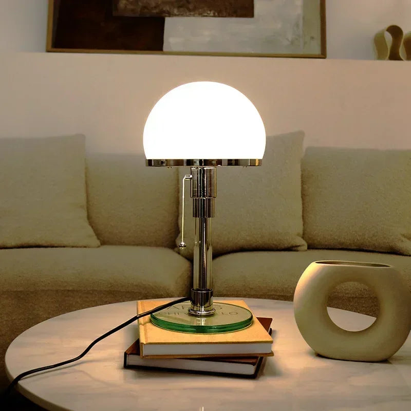 Mushroom table lamp with frosted glass shade and polished chrome body.