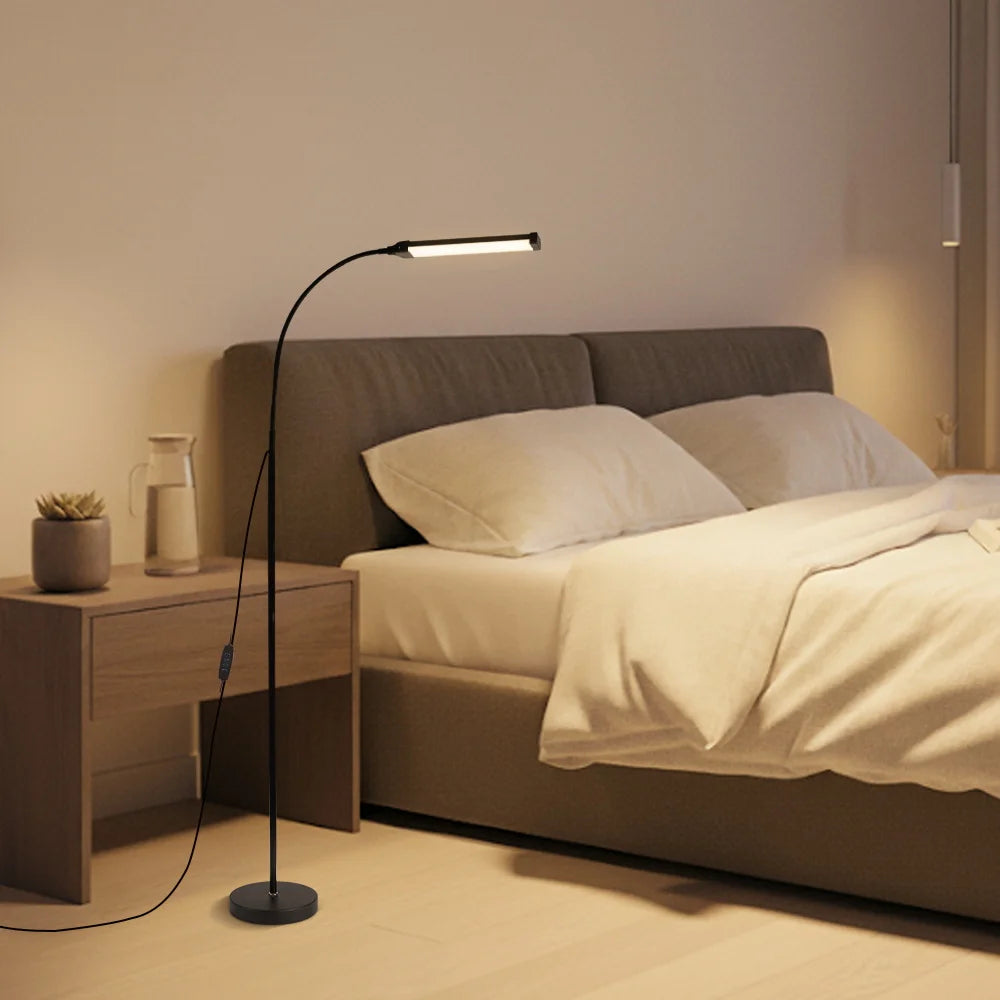 Bedroom with a standing lamp next to a bed