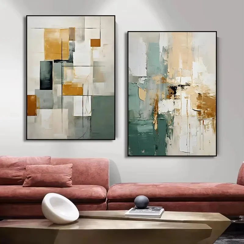 Two abstract paintings on a wall above a pink sofa in a living room setting.