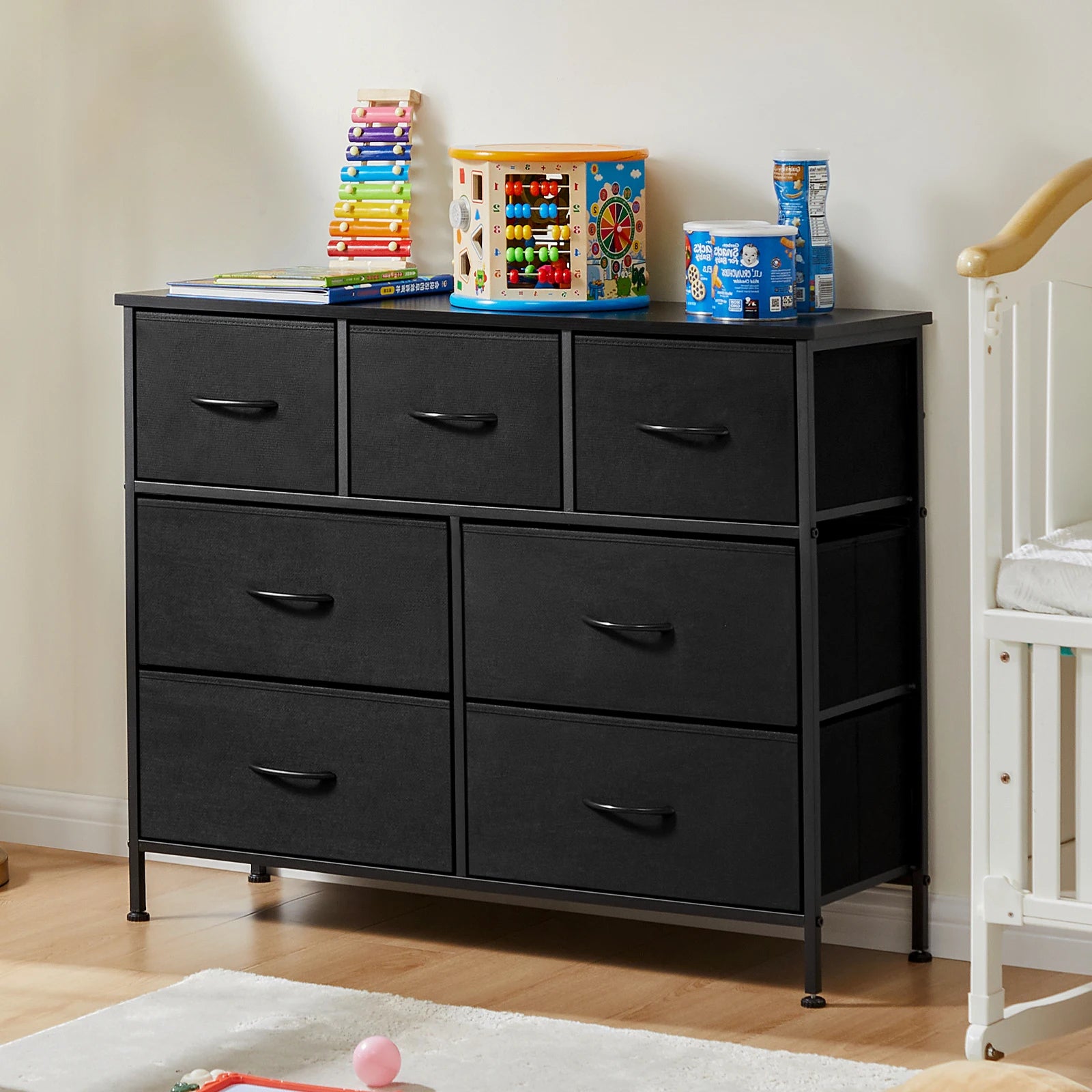 Black 7-drawer fabric dresser.
