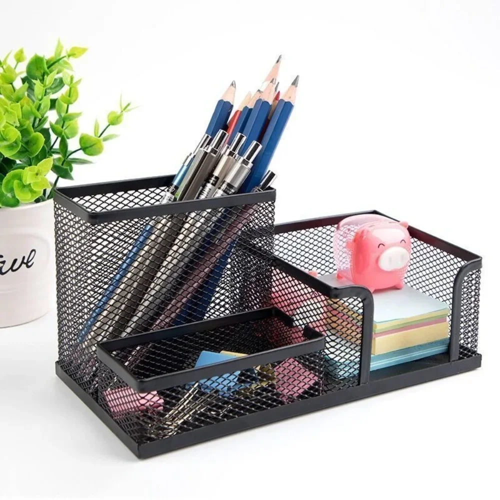 Black mesh desk organizer with stationery items on a white background