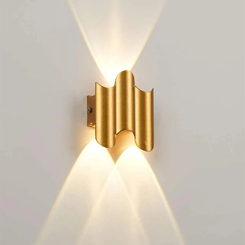 Gold 2-wave wall light with compact ripple profile and elegant up-and-down lighting pattern