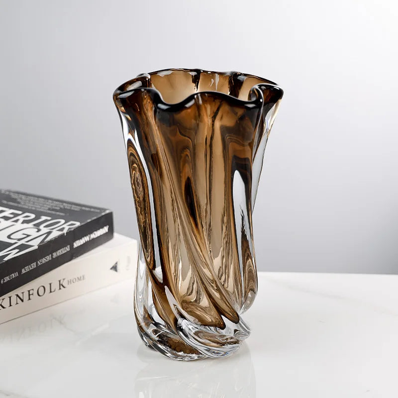 Close-up of twisted glass vase highlighting flowing pattern