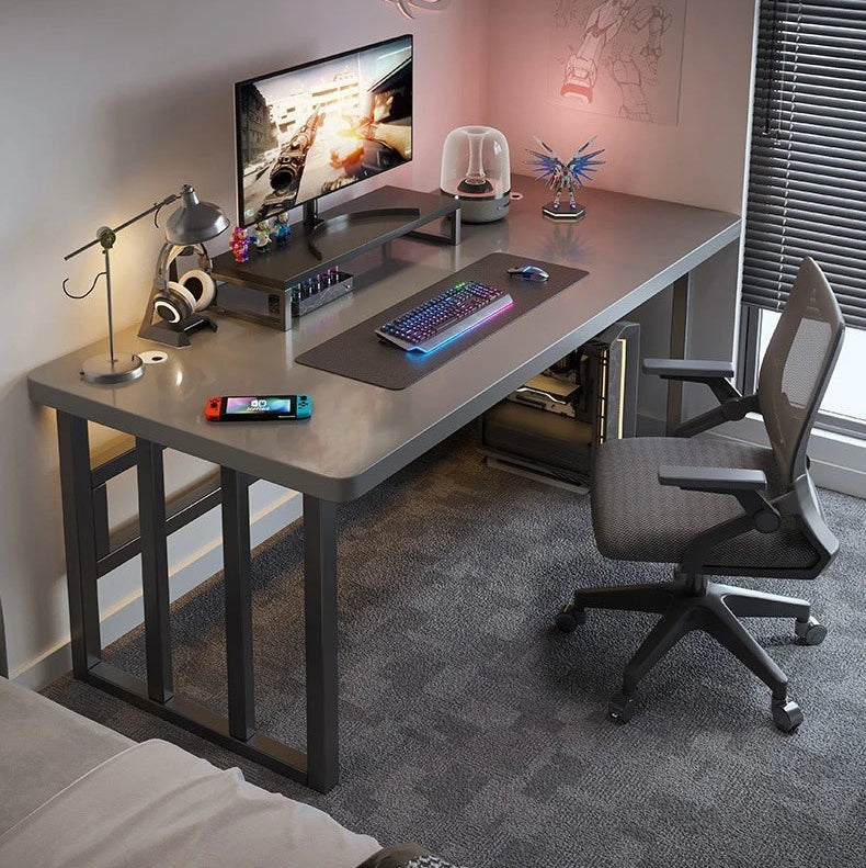 Modern office setup with a spacious computer desk, chair, and monitor.