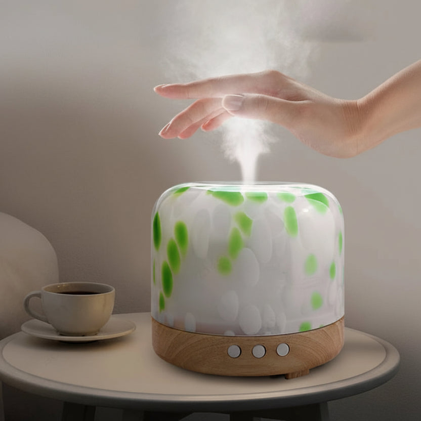 Humidifier on a table with a hand reaching towards it, text about its benefits.