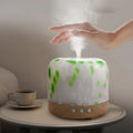 Humidifier on a table with a hand reaching towards it, text about its benefits.