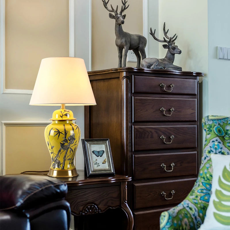 Tall yellow ceramic floral table lamp with a white fabric shade and a height of 68 cm