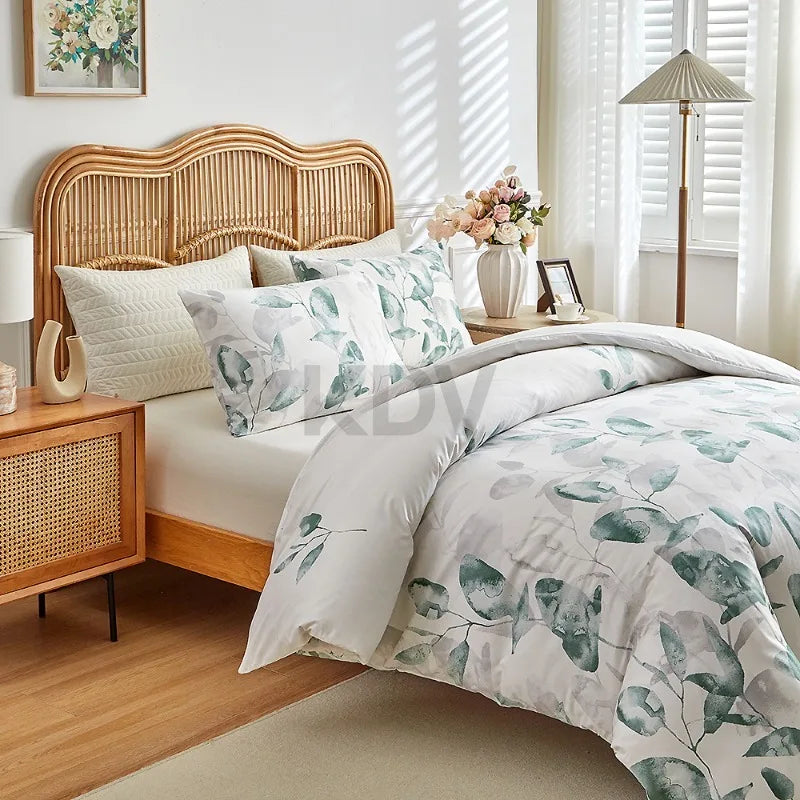 White duvet cover set with green eucalyptus leaf print and matching pillowcases