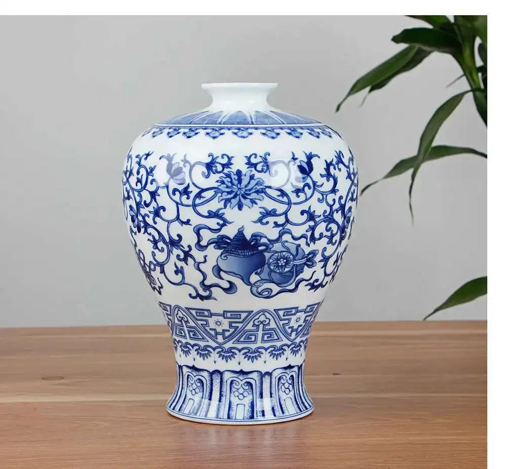 Blue and white ceramic vase with intricate patterns on a wooden surface.