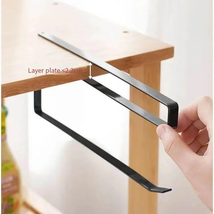 Black metal rails against a wooden surface.