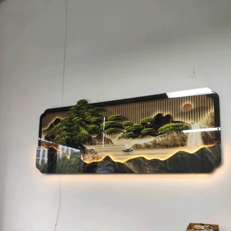 Decorative LED wall art with a landscape design on a white wall