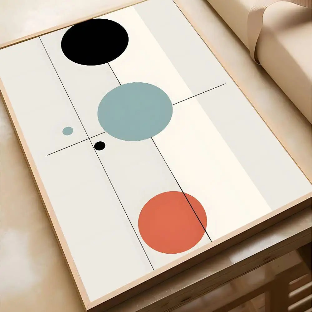 Abstract geometric canvas print featuring black, teal, and terracotta circles connected by fine lines on a cream background, displayed in a natural wood frame.