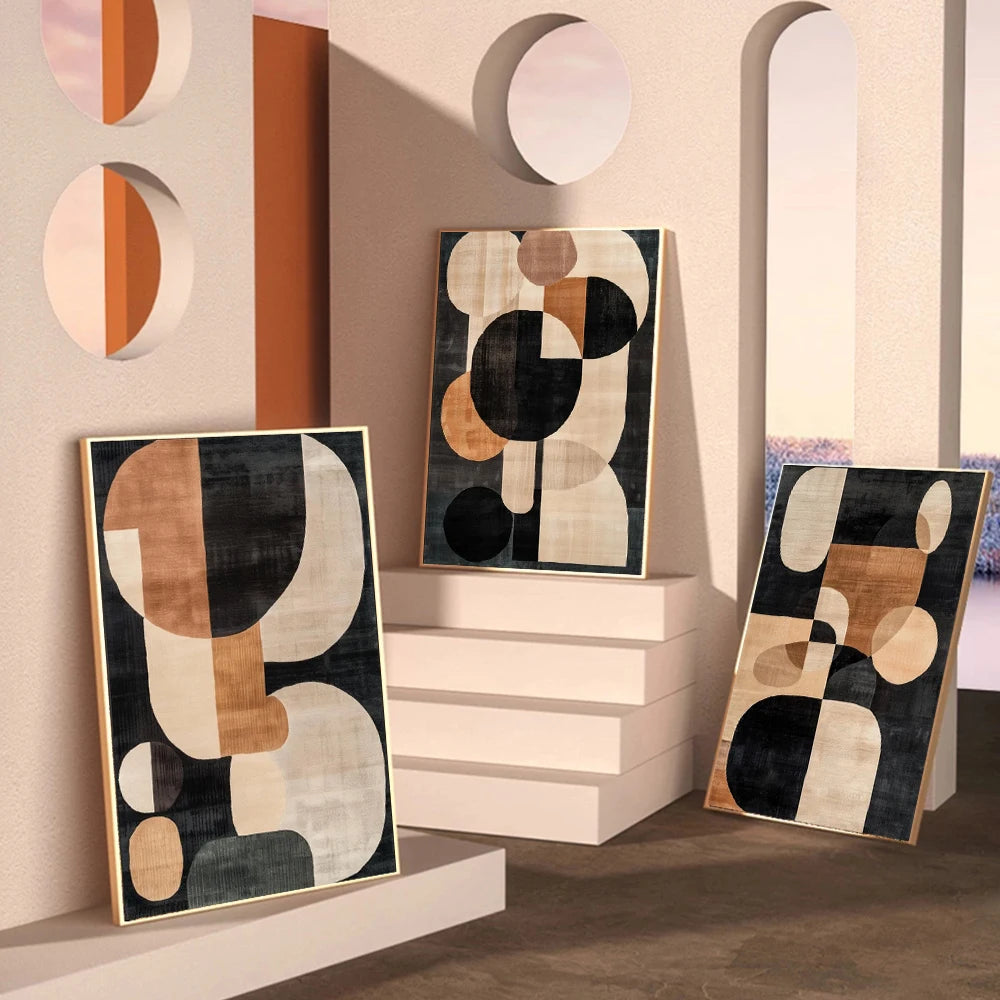 Abstract geometric art pieces on a wall with a modern interior setting.