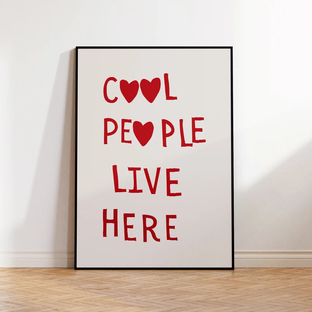 Cool People Live Here: "Cool People Live Here" red quote print in a black frame