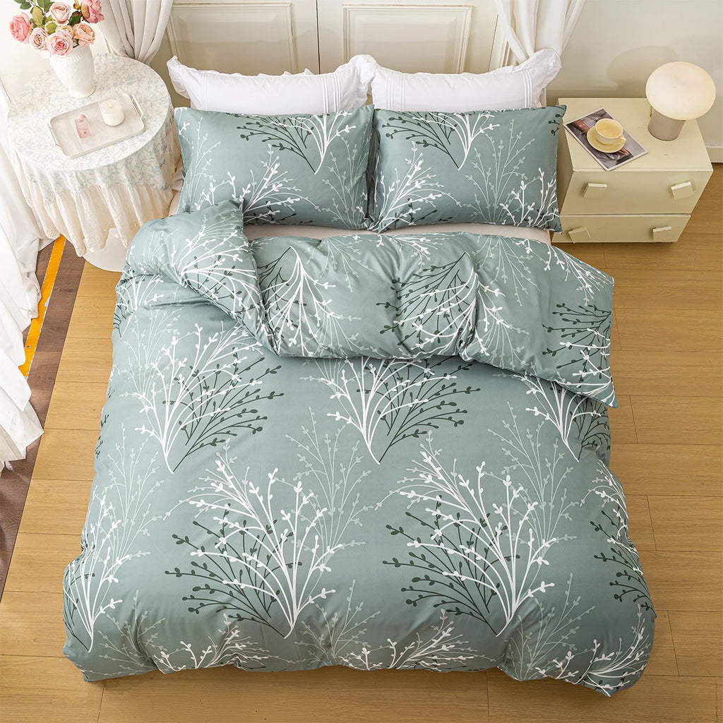 Sage green bedding set with soft botanical print styled in a bright minimalist bedroom