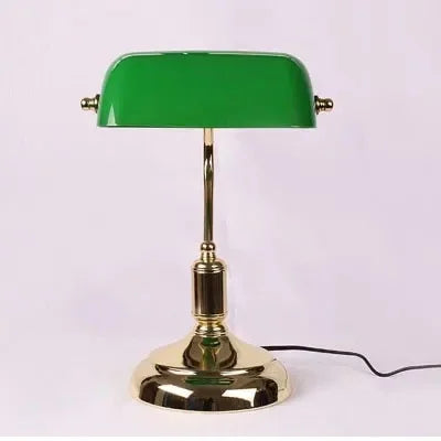 Green glass table lamp with polished gold base in a classic modern banker style