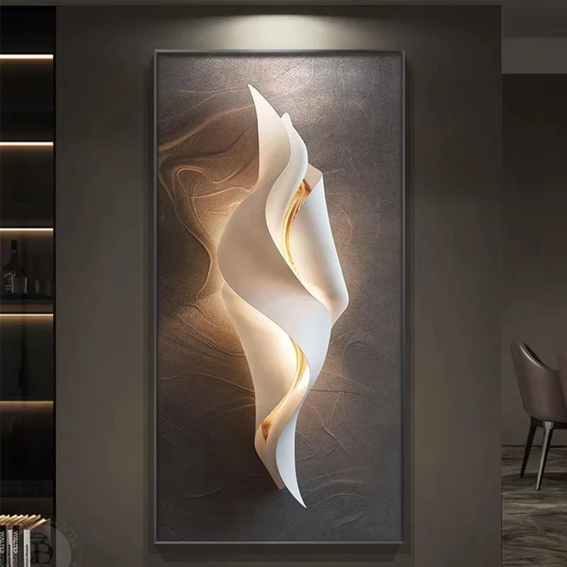 Lumina Flow LED wall art light with compact twisted white ribbon design and warm gold glow on a brown textured canvas
