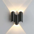 Black 2-wave waterproof wall light with minimalist curved design and soft warm illumination