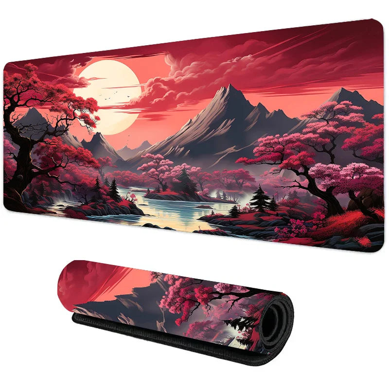 Large desk mat with vivid red blossom trees, mountains, and a glowing sunrise reflected in a river