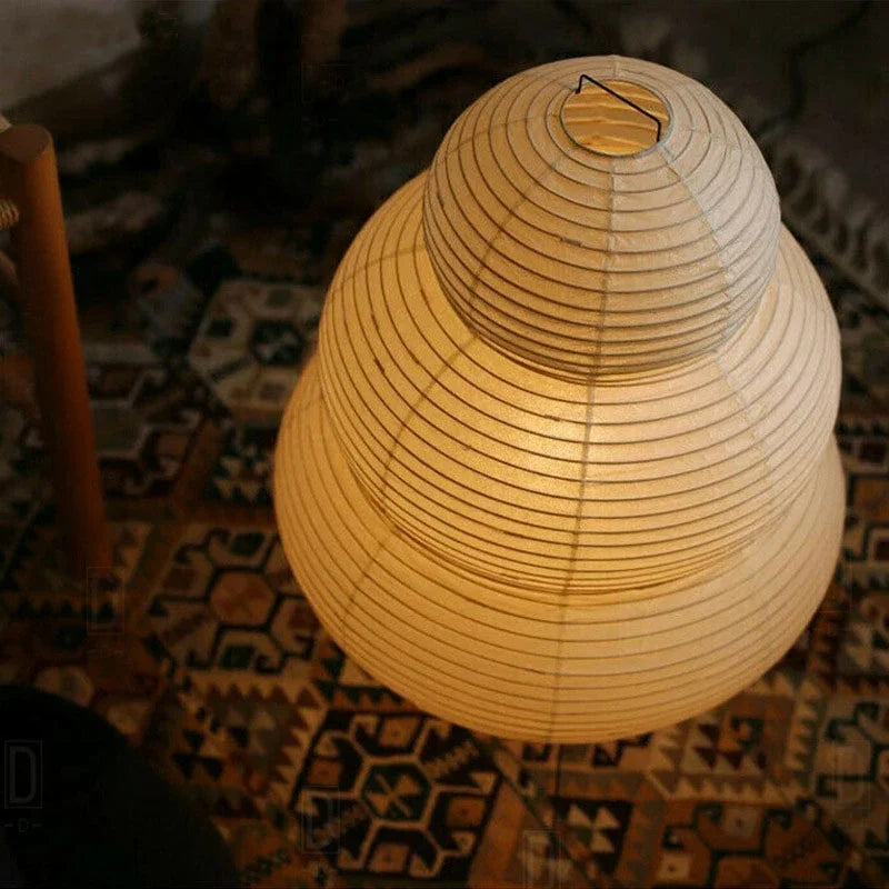 A round rice paper Ja[anese lamp on a patterned rug