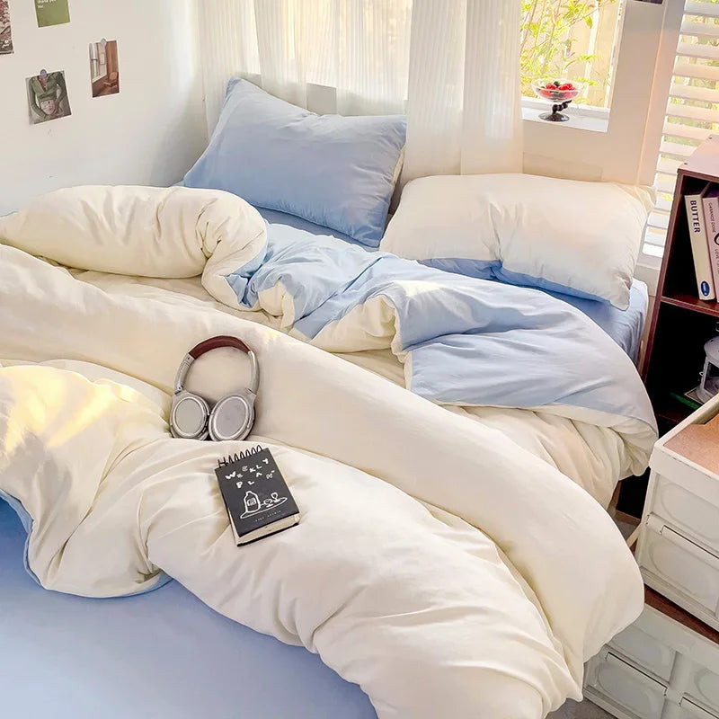 Blue and cream two-tone cotton bedding set in a cosy bedroom setting