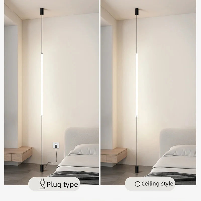 Dual slim Italian floor lamps mounted in a contemporary white living space