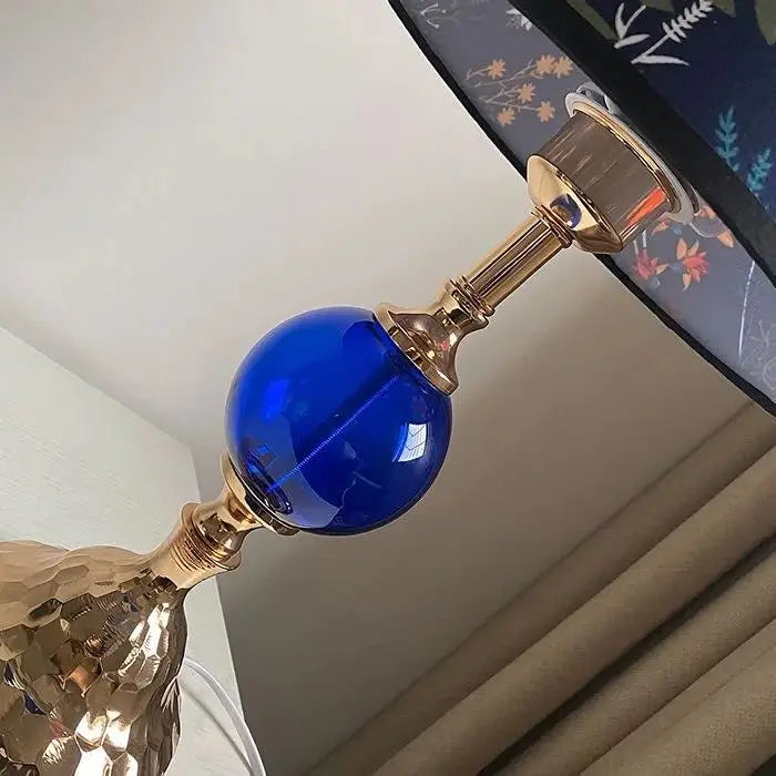 Sapphire blue glass lamp stem with polished metal finish