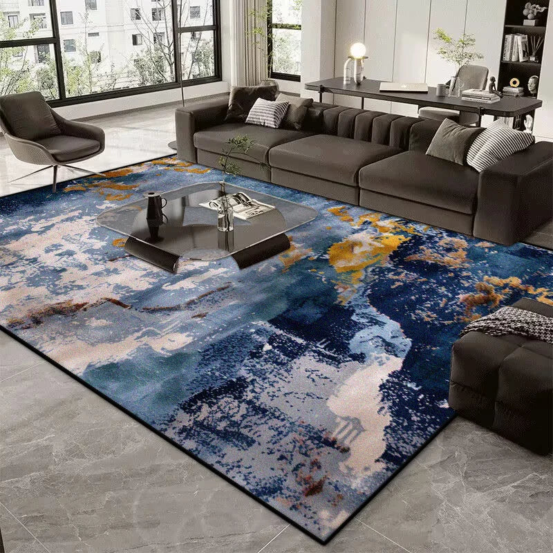 Living room with a large abstract-patterned rug, gray sofa, and coffee table.