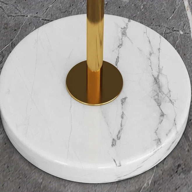 Thick marble base detail with gold metal pole