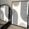 Neutral abstract wall art with curved black lines and soft beige shapes in minimalist style