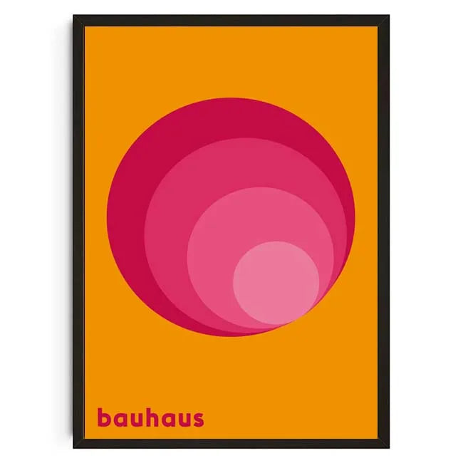 Framed poster with a pink circle design on an orange background, featuring the word 'bauhaus'.