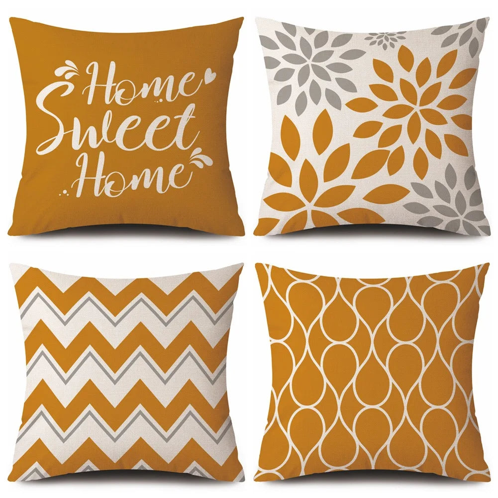 Four decorative cushion covers with different patterns on a white background