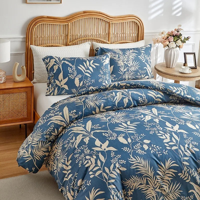 Deep blue duvet cover set with beige botanical foliage print and matching pillowcases