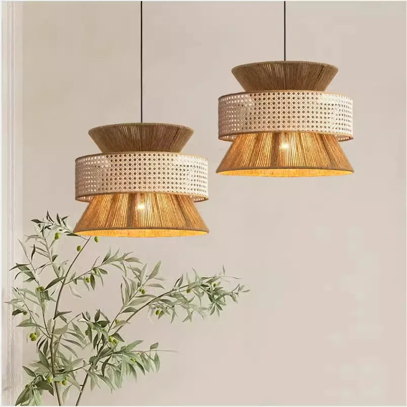 Two hanging pendant lights with wicker design on a neutral background